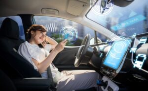 woman using smart phone in autonomous car.
